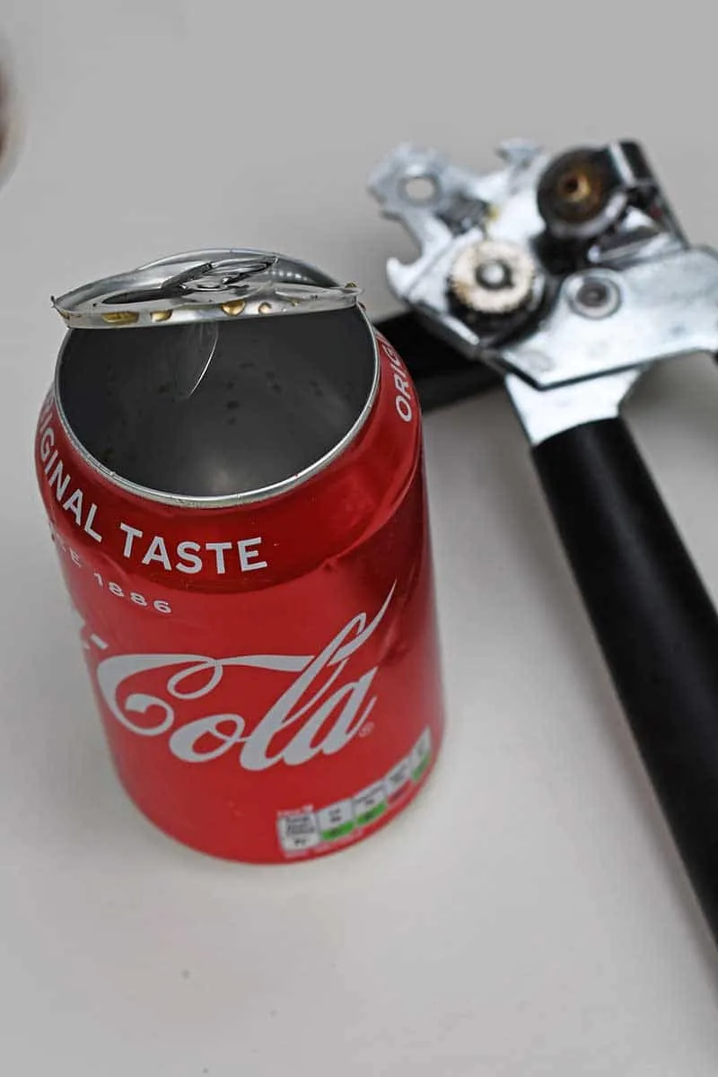 Taking the top off a coke can