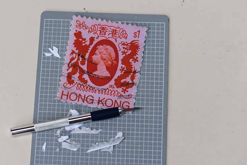 Cutting Perforations into stamp photo