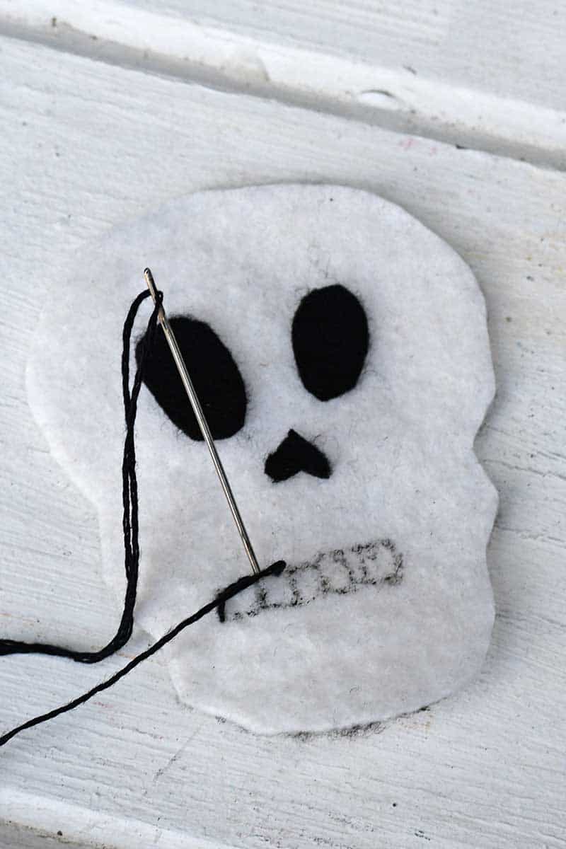 embroidering Halloween felt decorations