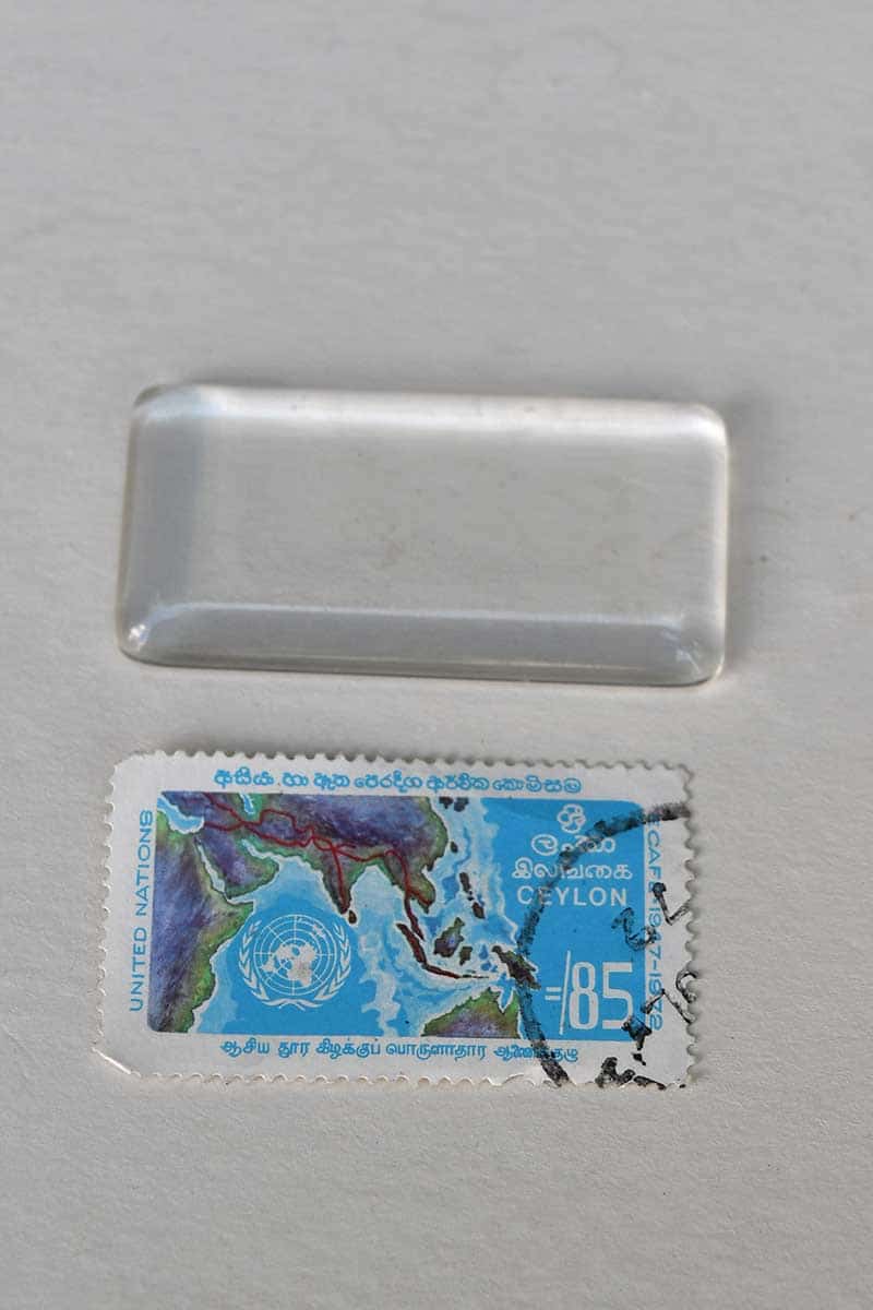 Postage stamp and glass tile