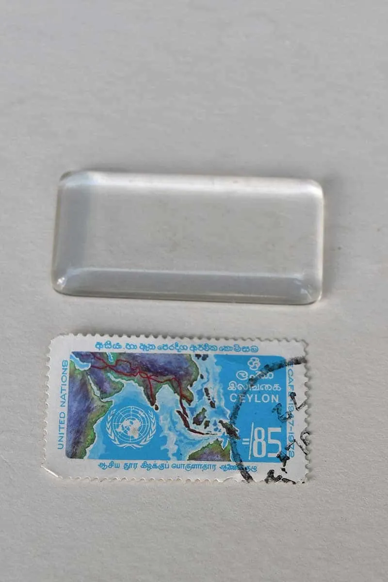 Postage stamp and glass tile