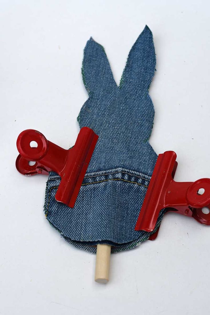 Gluing the denim bunny together