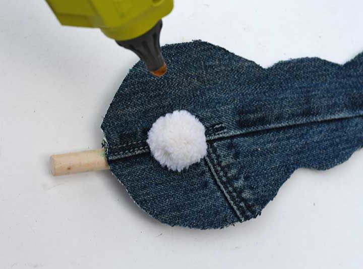 Gluing on the pompom tail