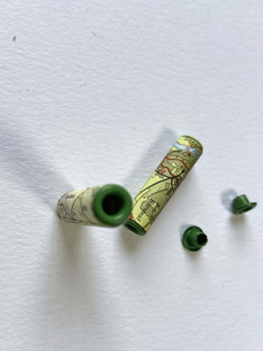 Adding eyelets to map paper beads