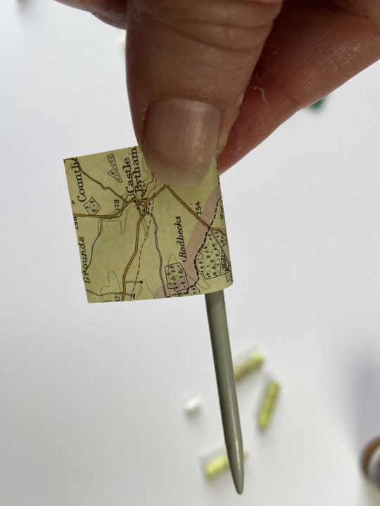 Wrapping map paper around a knitting needle