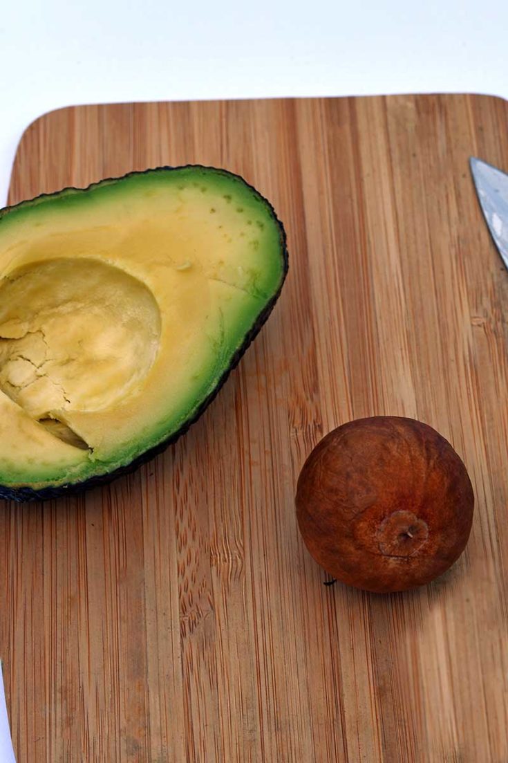 Removing an avocado pit for crafting with