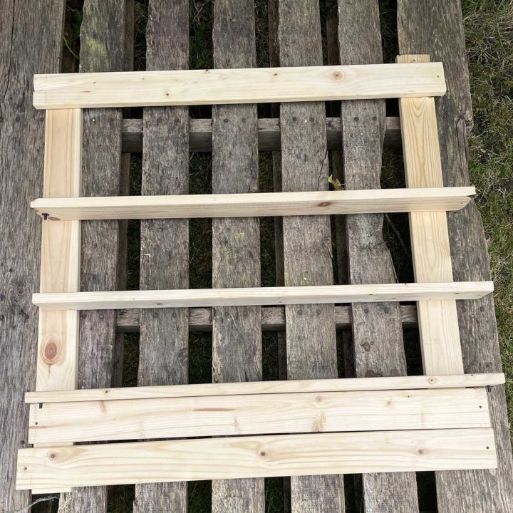laying our bed slat shelf frame