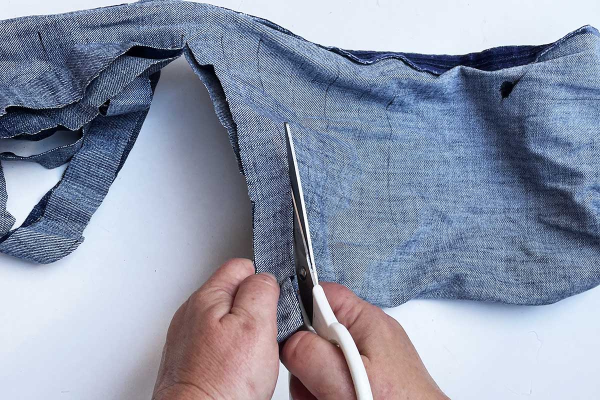 cutting denim leg into strips