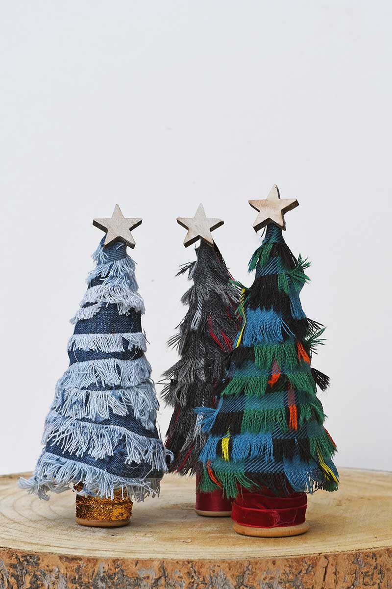 Three scrap fabric finged cone Christmas trees with wooden starts