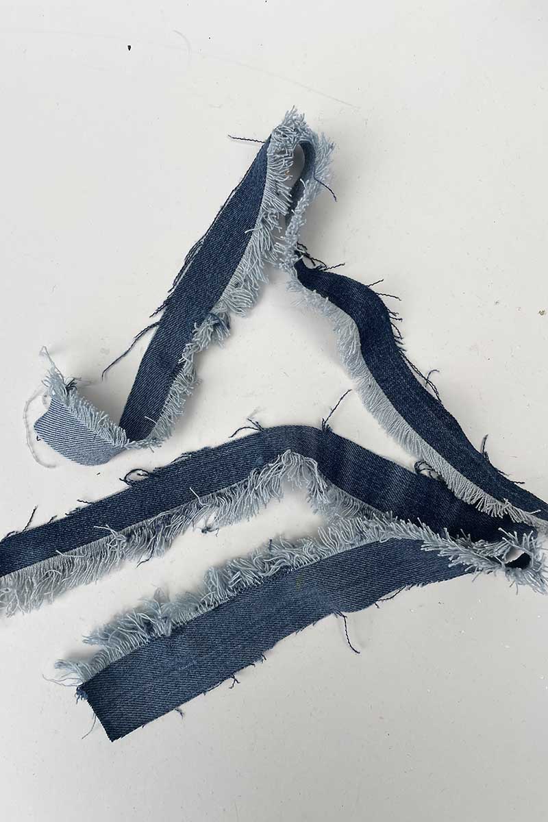 Frayed denim fabric