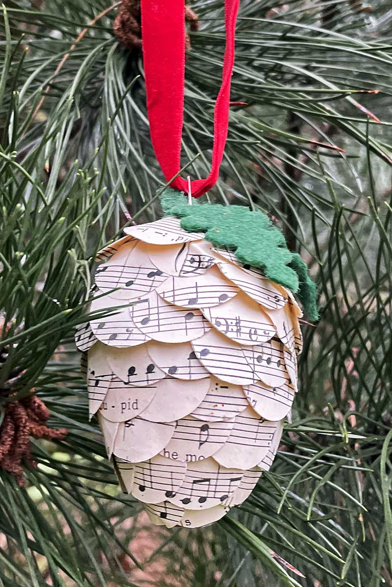 upcycled music paper into a paper pine cone.