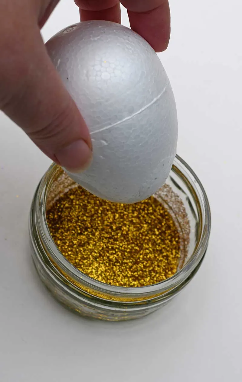 dipping polystyrene egg in glitter