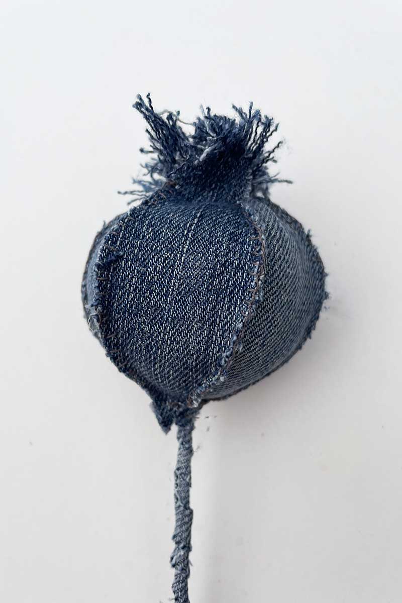 Denim fabric poppy seed pod