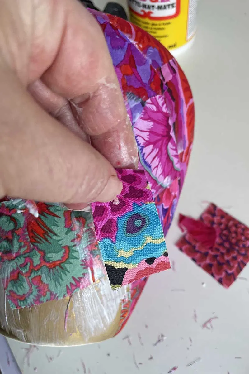 Cutting smaller pieces of fabric for the vase decoupage