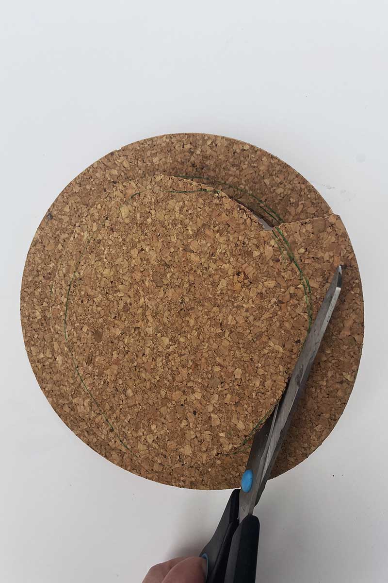 Cutting the cork board for plant pot