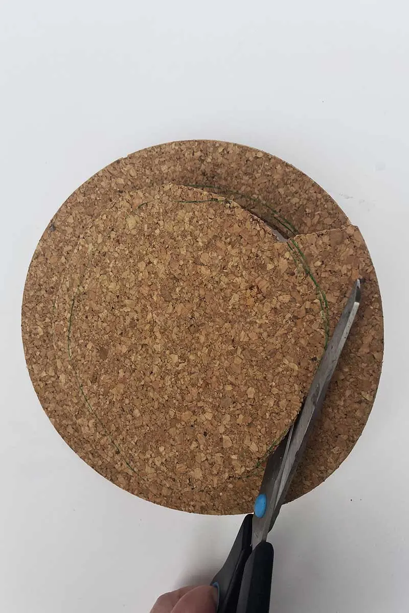 Cutting the cork board for plant pot