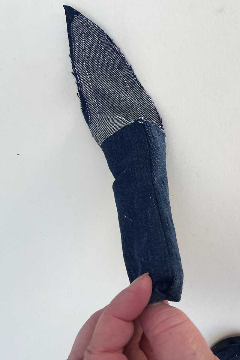 Turning the denim Mother in law's tongue leaf right sides out.