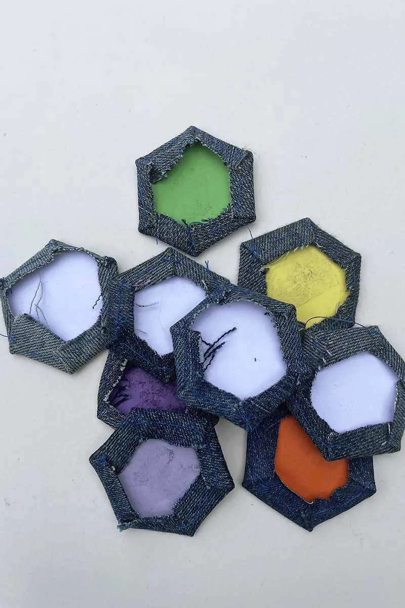 Lots of stitched hexagons for fabric mug rug