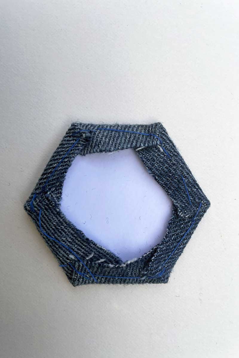 Stitched denim hexagon for English paper pieced mug rug