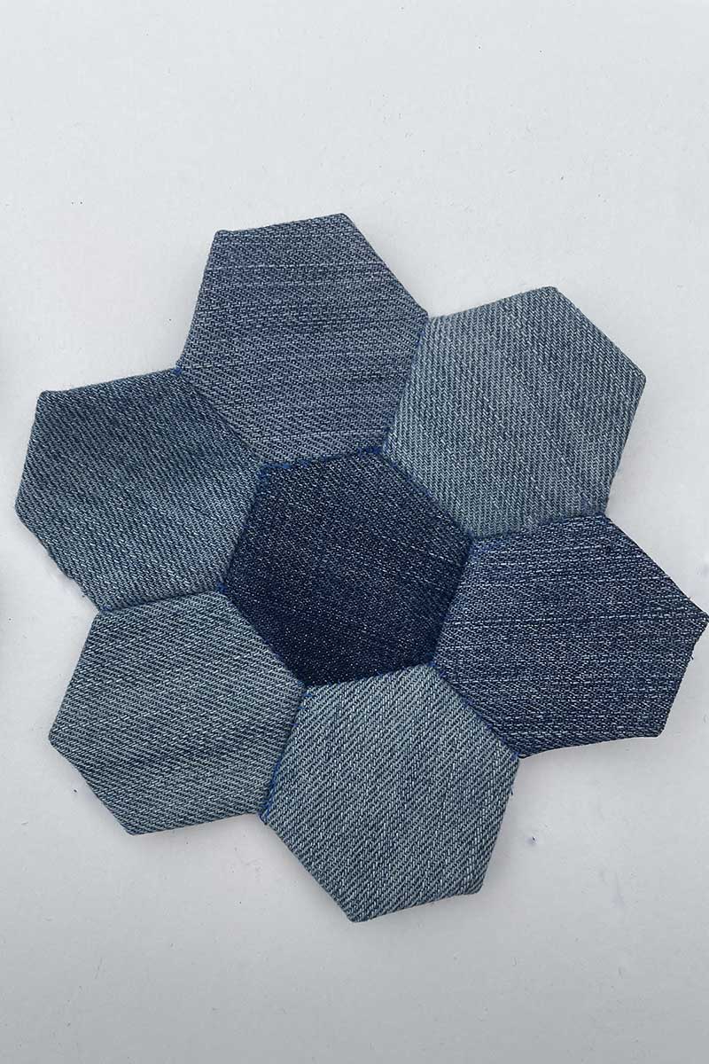 Stitched hexagon flower shape for denim mug rug