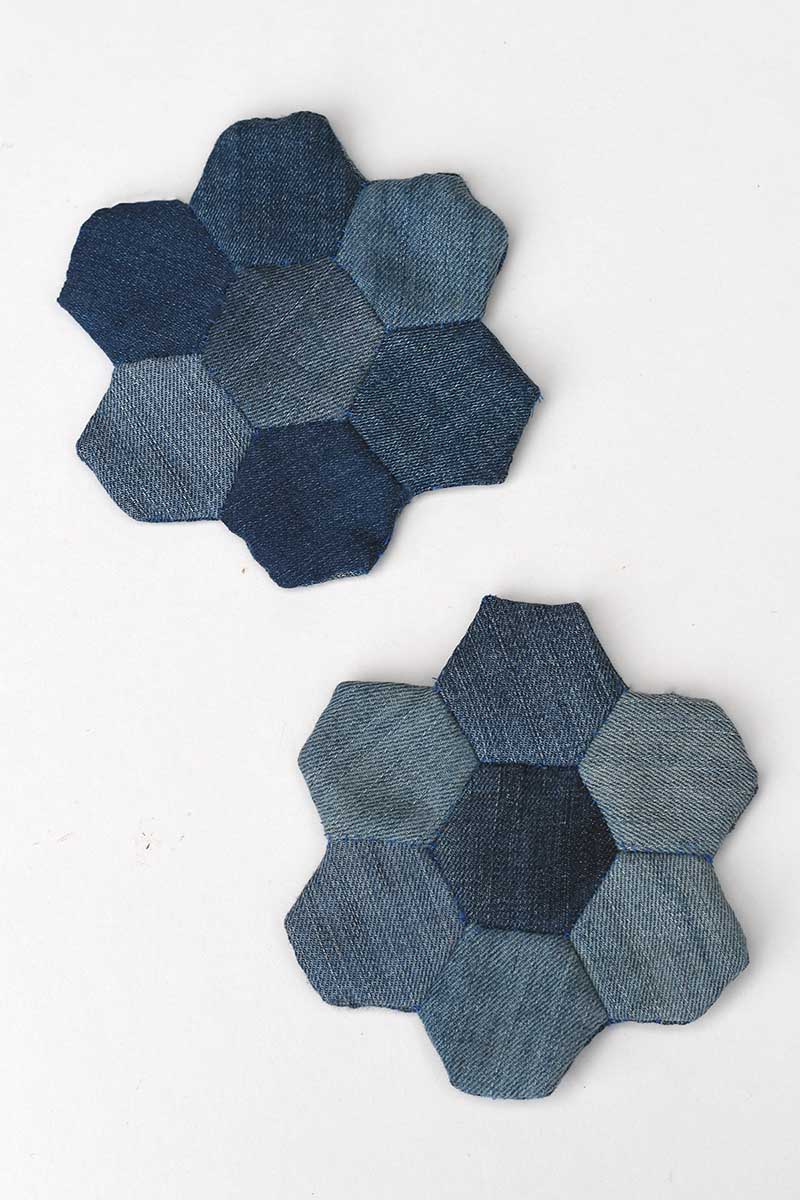 Two denim mug rugs made with hexagon English Paper piecing
