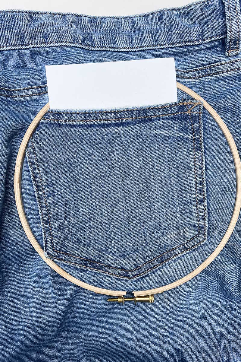 preparing a jean pocket with embroidery hoop