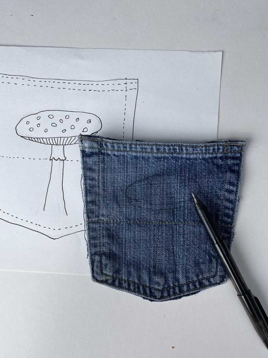 Sketching mushroom onto denim pocket