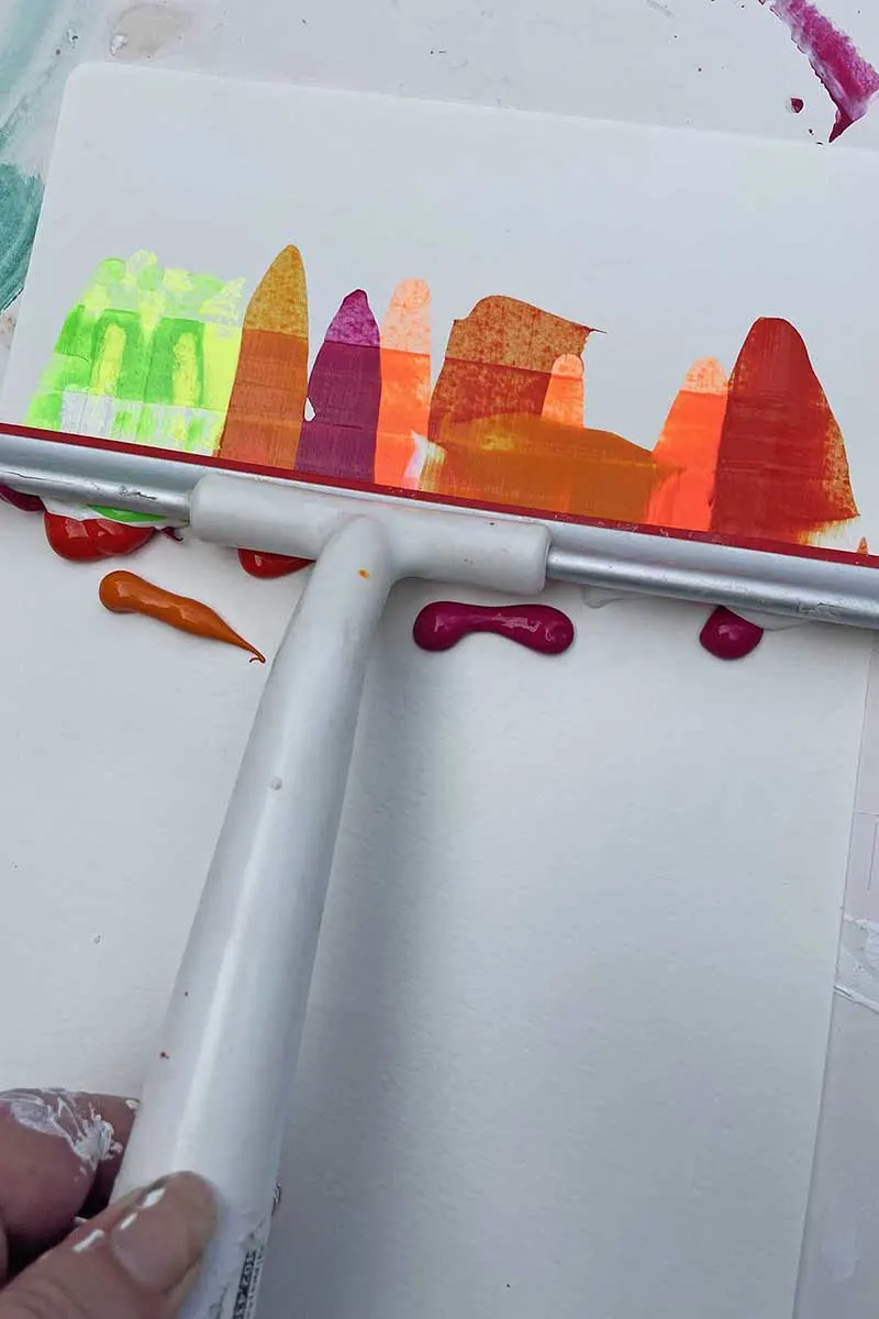 Learning how to paint a box with a squeege