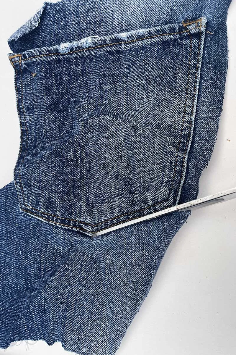 Cutting out the jeans pocket for embroidery