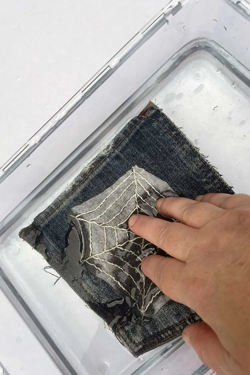 Dissolving the embroidered paper