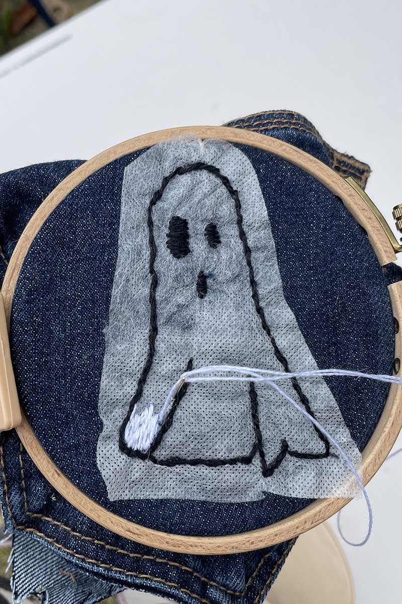 Embroidering a jeans pocket for a cute Halloween treat bag