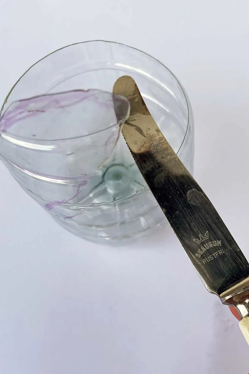 melting edge of plastic with a knife
