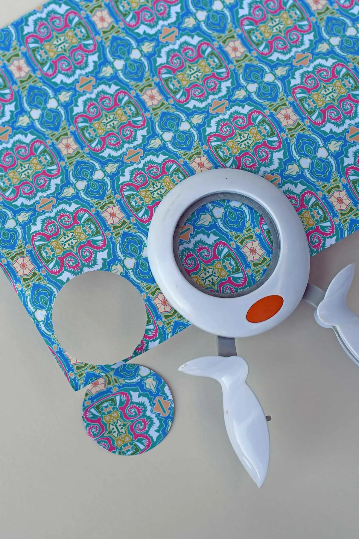 Punching out circles from the decorative paper
