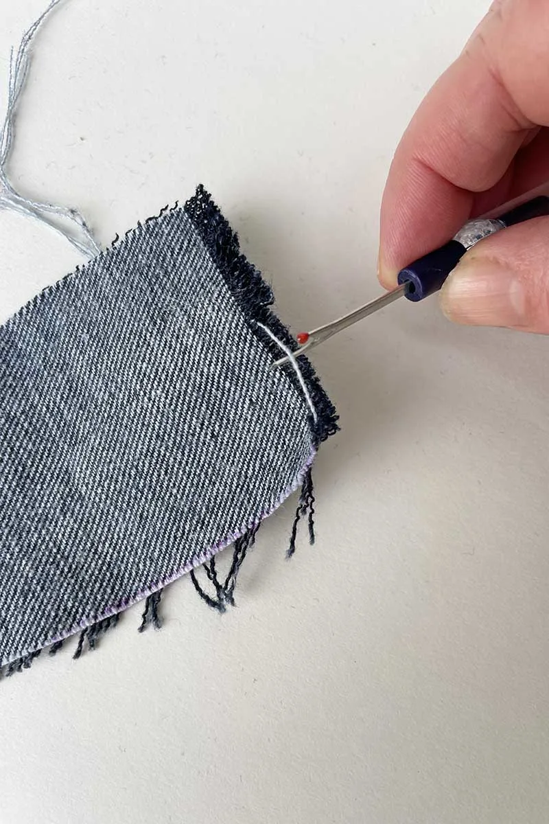 Fraying the denim to make a tassel