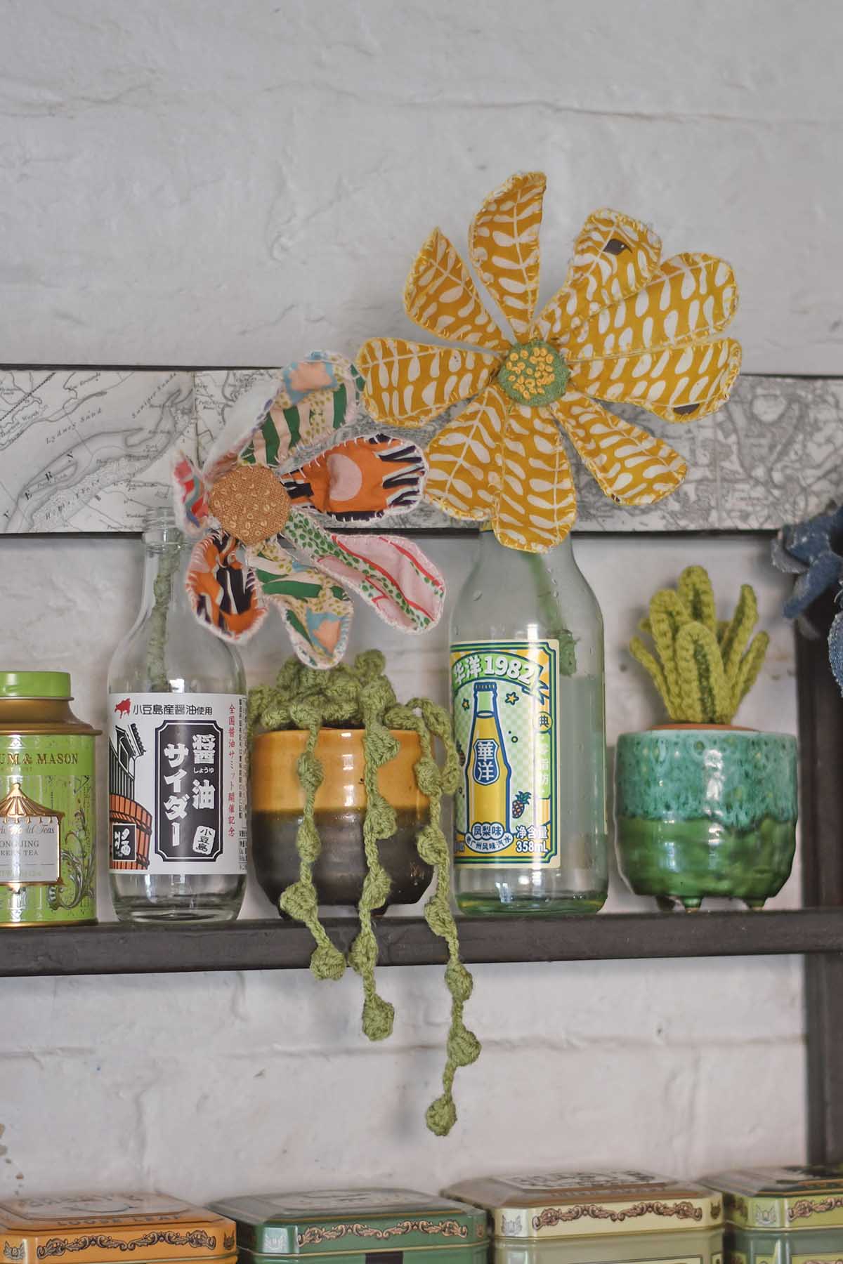 Fabric flowers on kitchen shelf