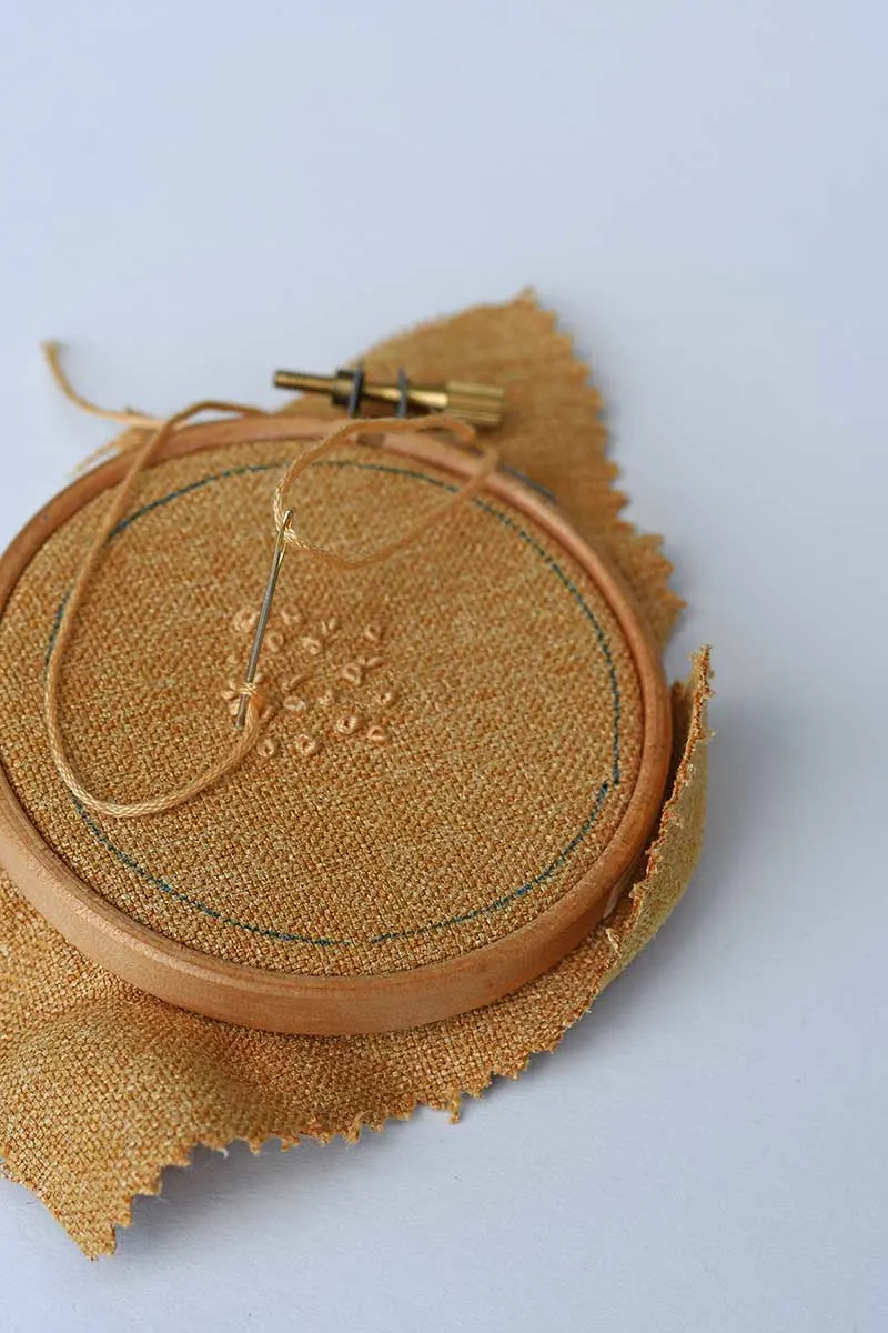 Embroidering French knots