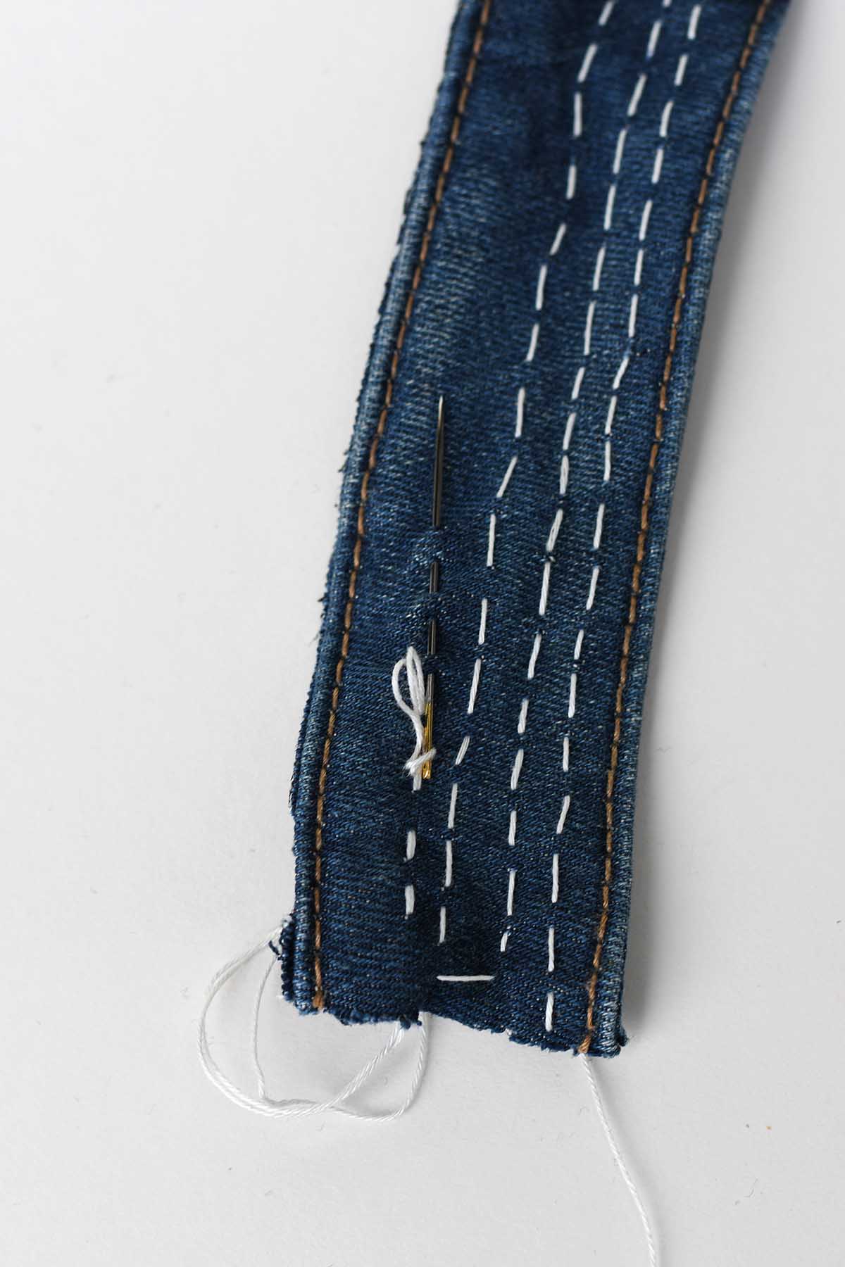 Sashiko stitching on a handmade bookmark from a denim waistband