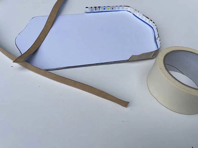 Adding an edge to the paper mache tray