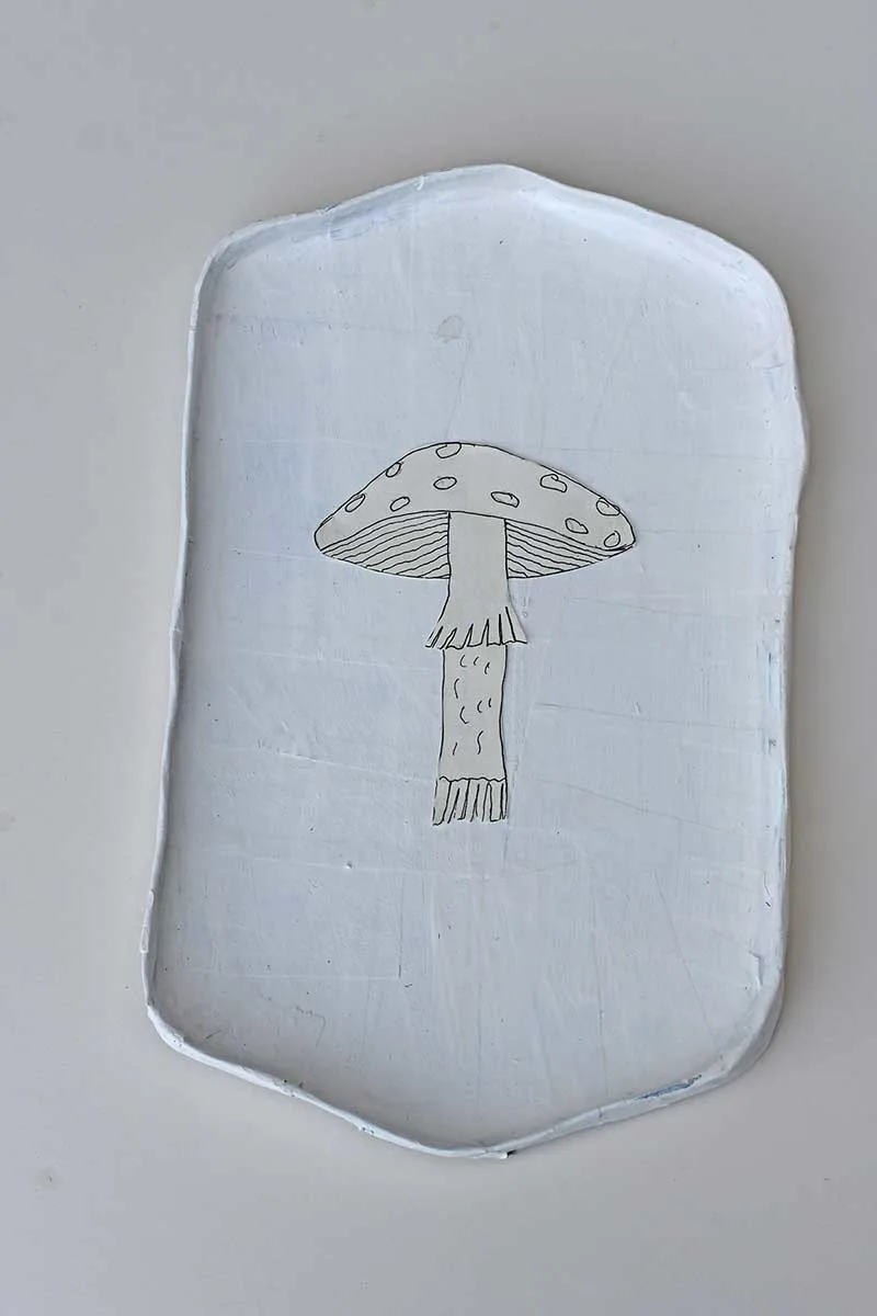 Sticking the mushroom design onto the Gesso painted tray