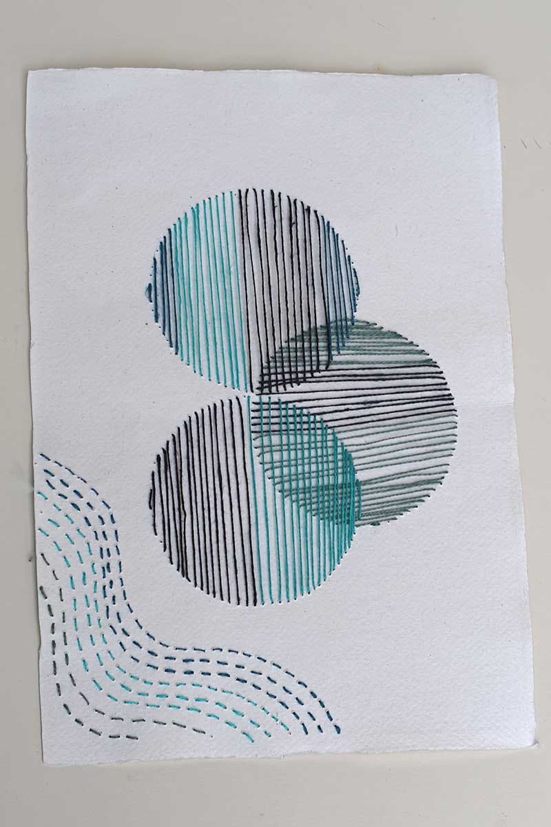 hand stitched paper embroidery design to be turned into a vase.