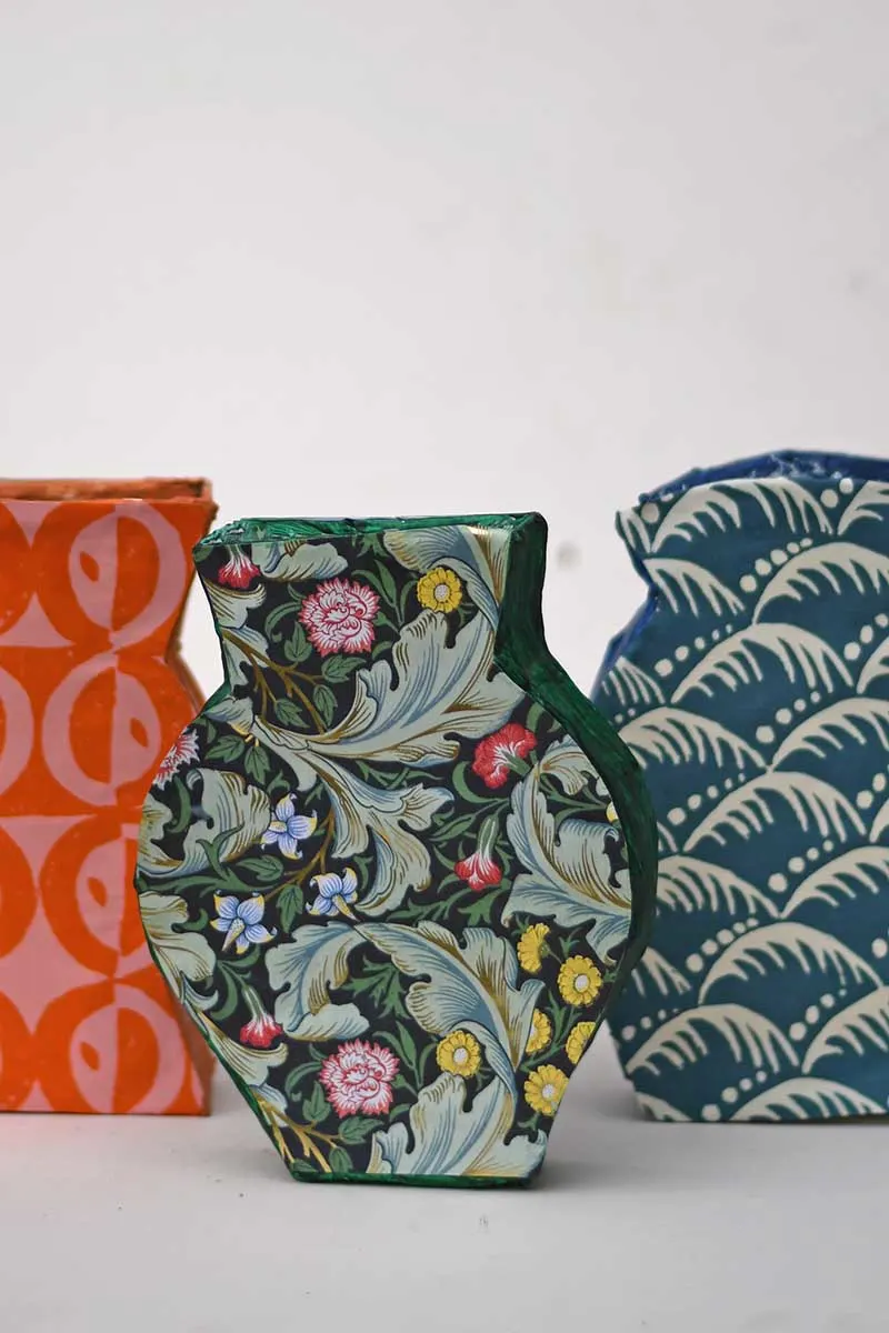 All three paper mache patterned vases
