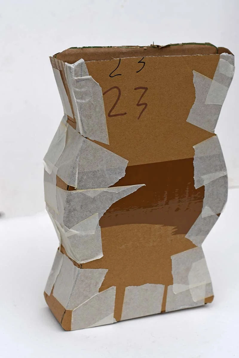 Taping cardboard vase together