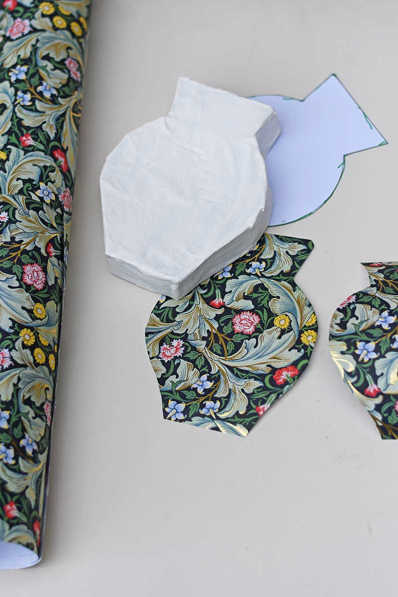 Decorating the vase with decoupaged gift wrap