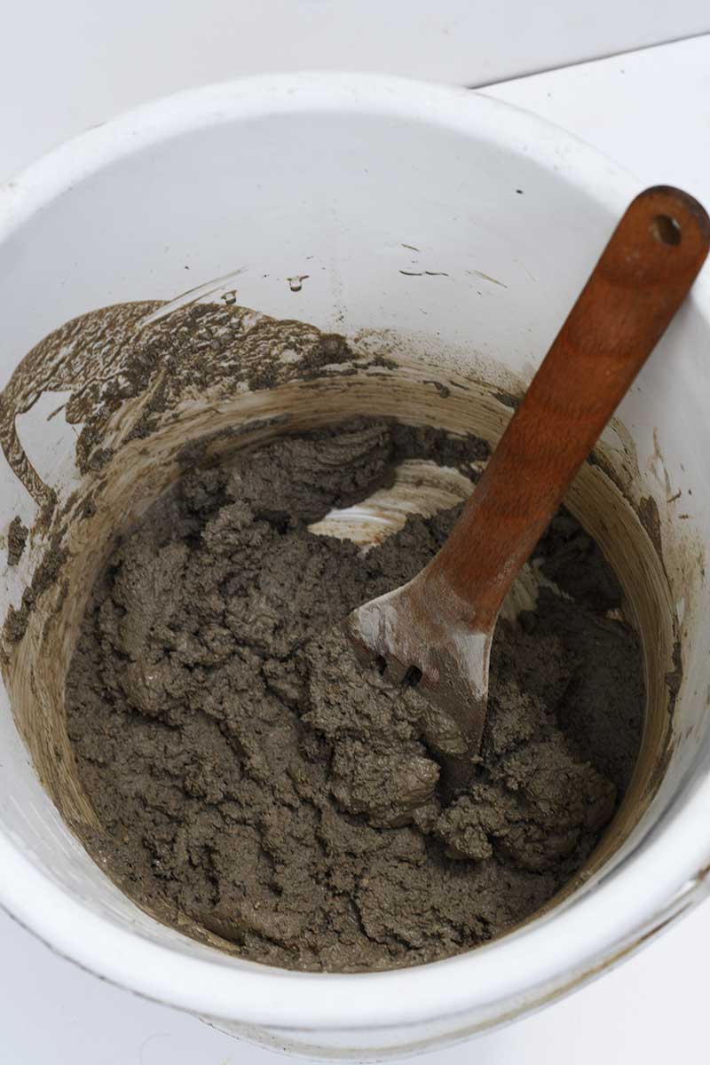 Mixing concrete in bucket