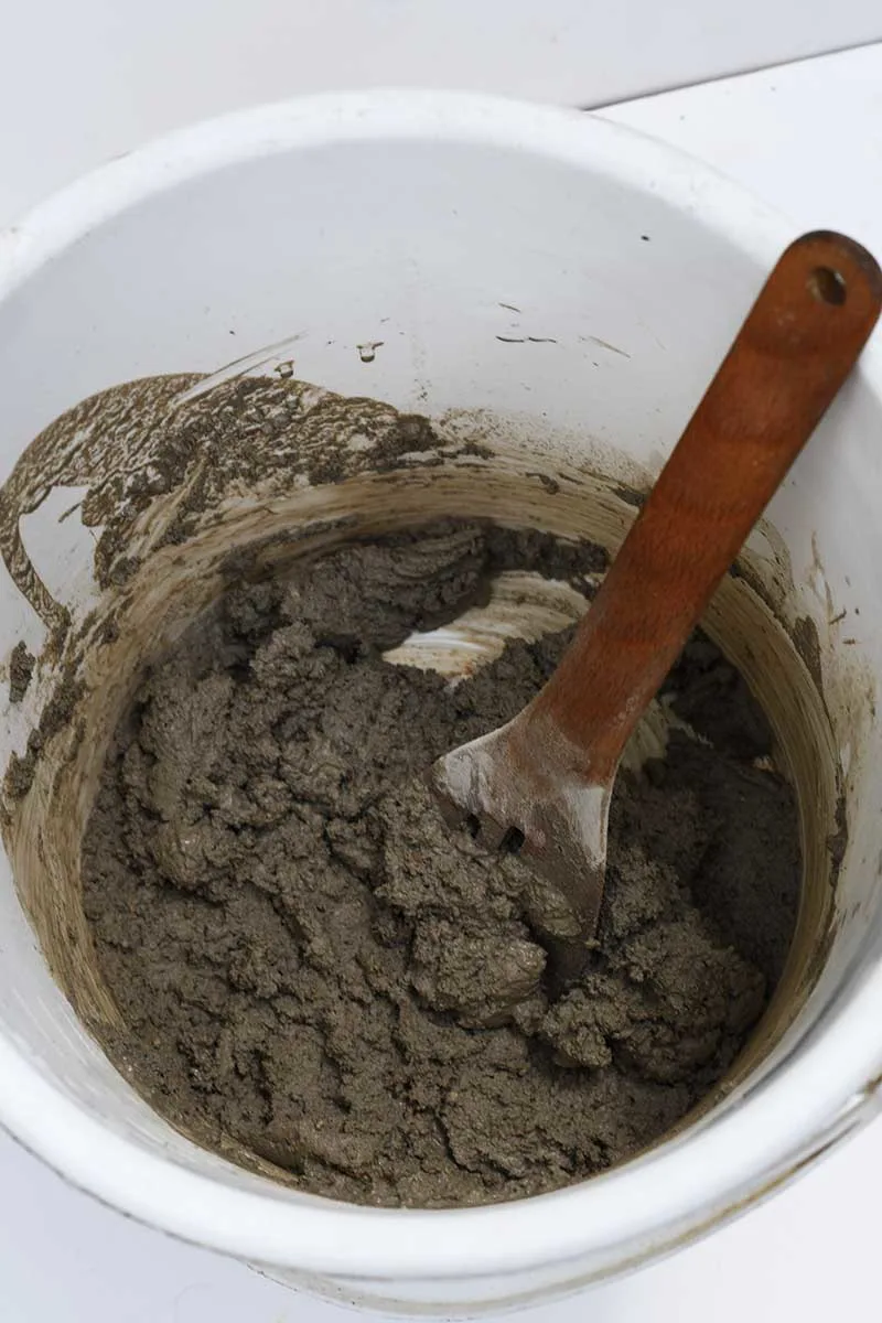Mixing concrete in bucket