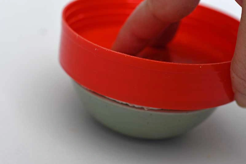 pushing clay into mould