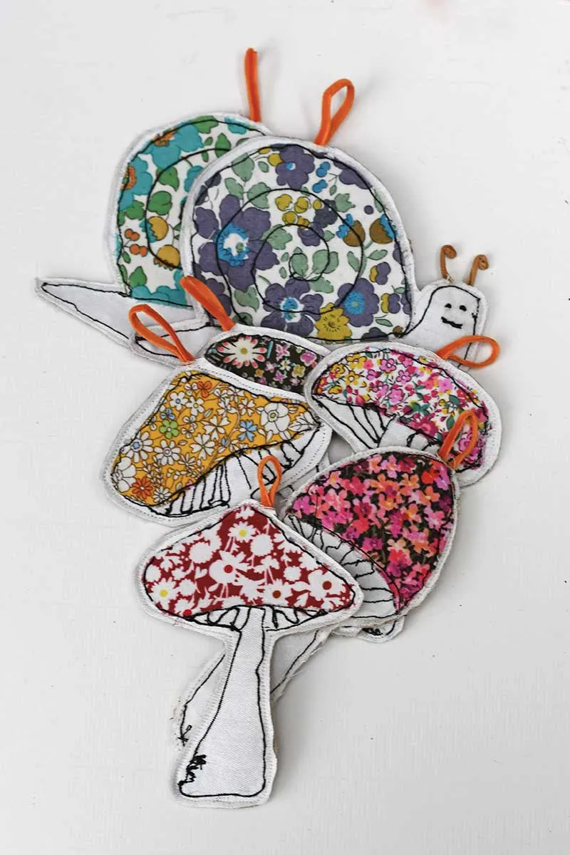 All seven four mushrooms and 2 snails scrap fabric free motion embroidery ornaments for fall