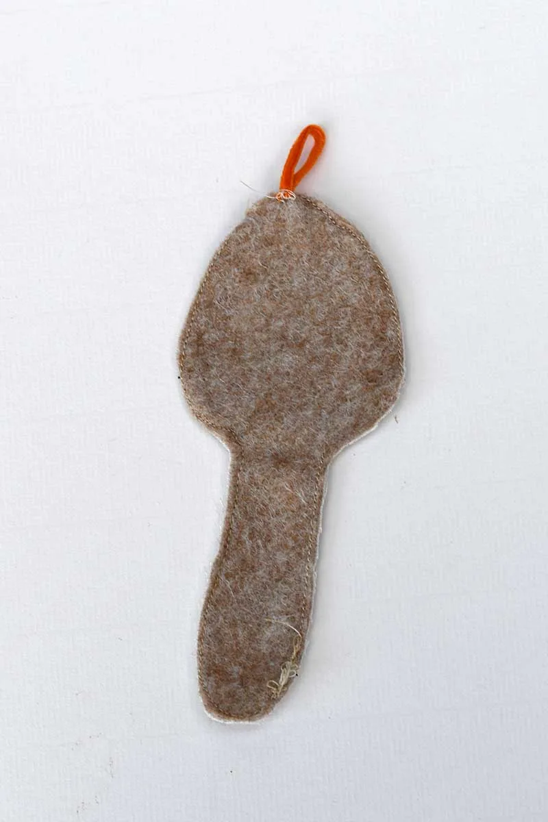 back of free motion mushroom ornament showing 