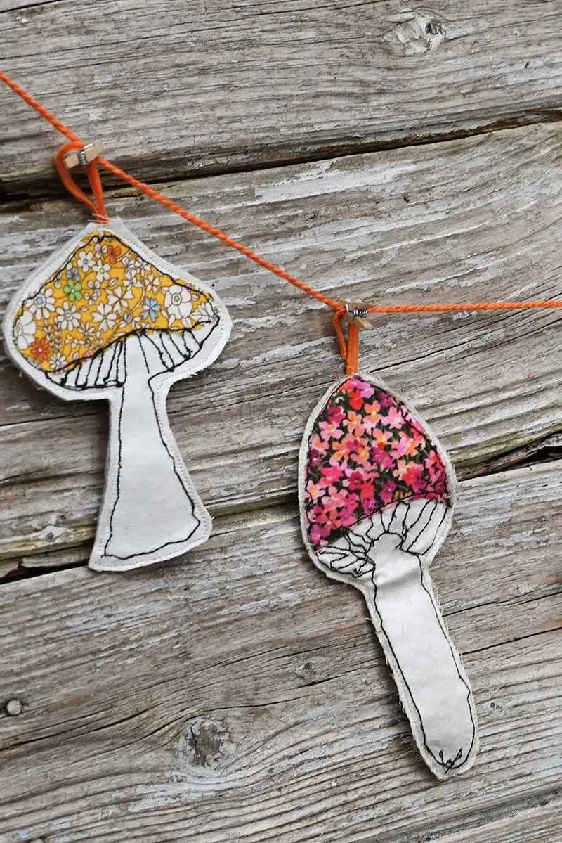 hanging free motion embroidery applique scrap fabric mushroom garland for fall