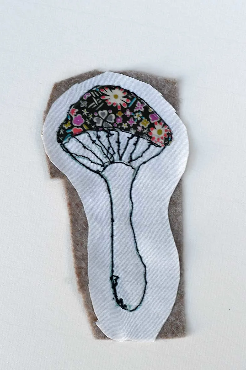 Adding felt backing to the mushroom embroidery